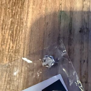 Brushed silver puzzle piece charm. 
Keep collective